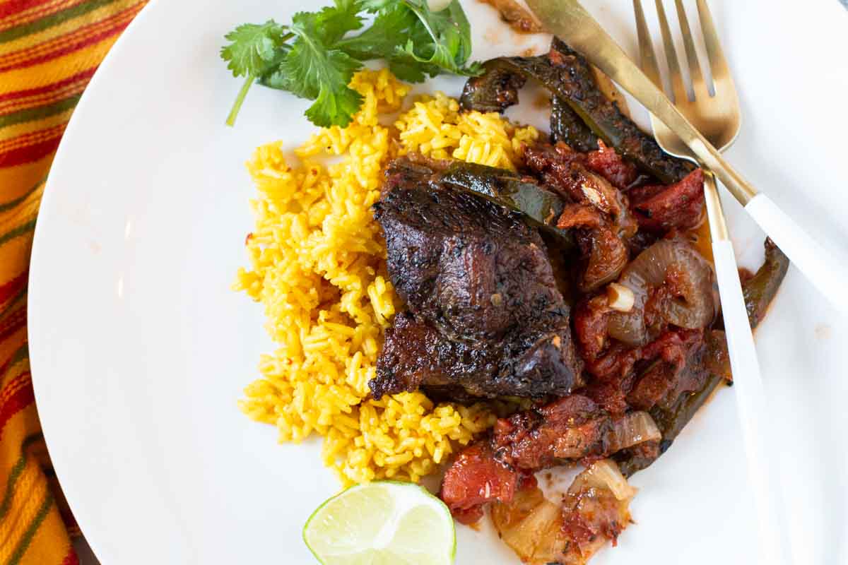 Mexican short ribs served over yellow Spanish rice.