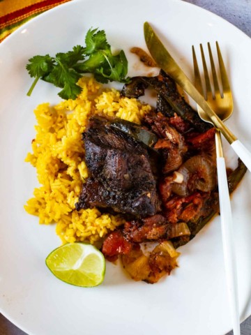 Mexican Short Ribs served over yellow rice.