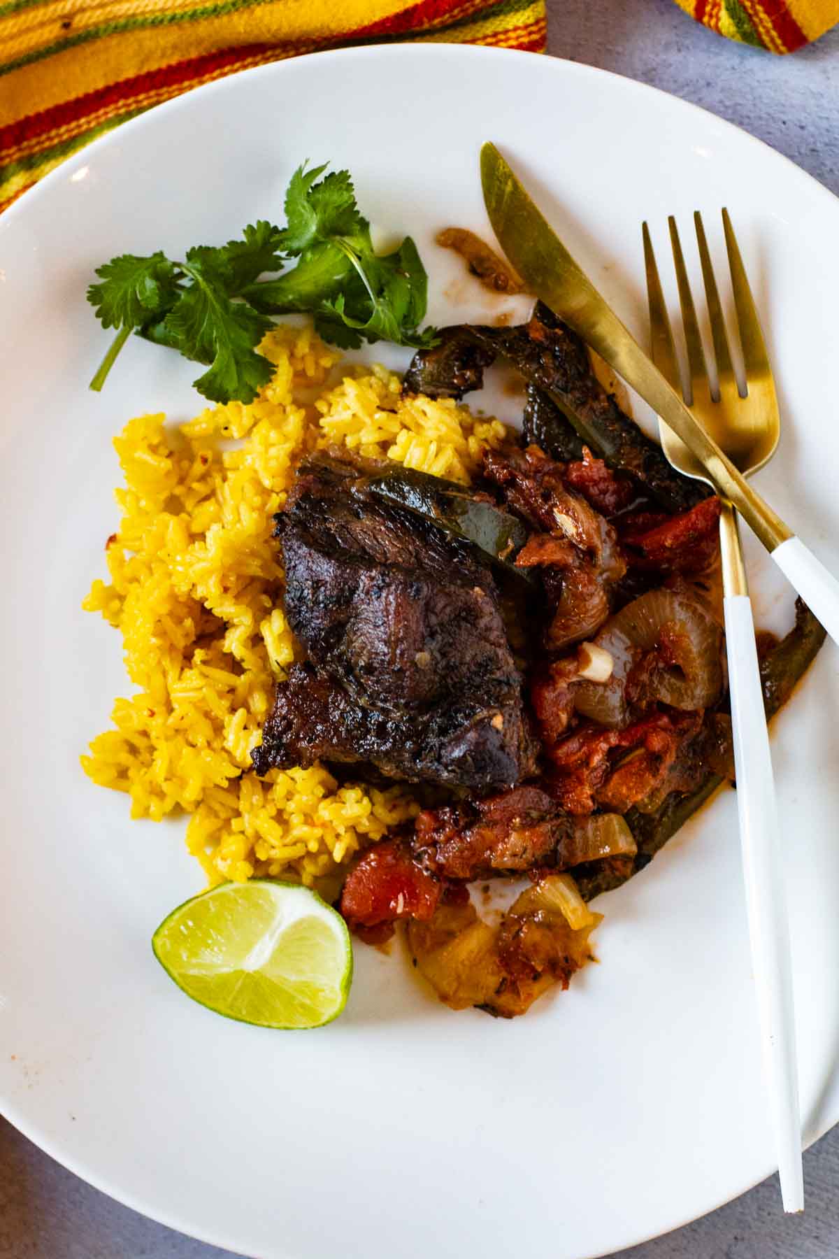 Mexican Short Ribs served over yellow rice.