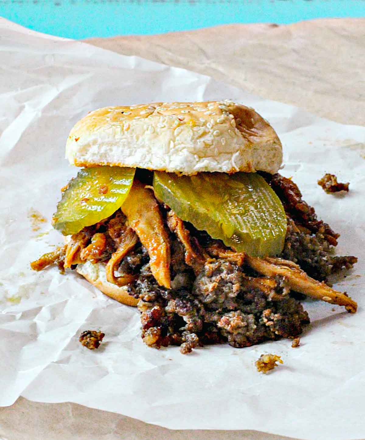 Kickin Chicken Sandwich with Sausage and pickles.