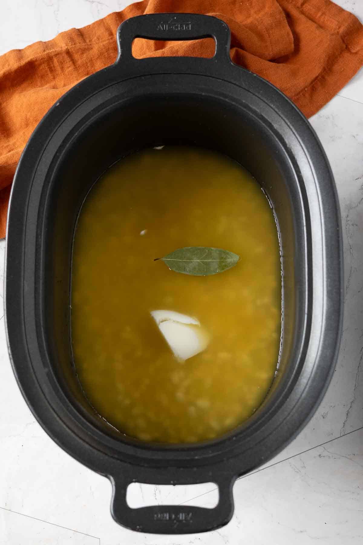 Step 1: Cooking great northern beans in a crock pot to make great northern bean soup.