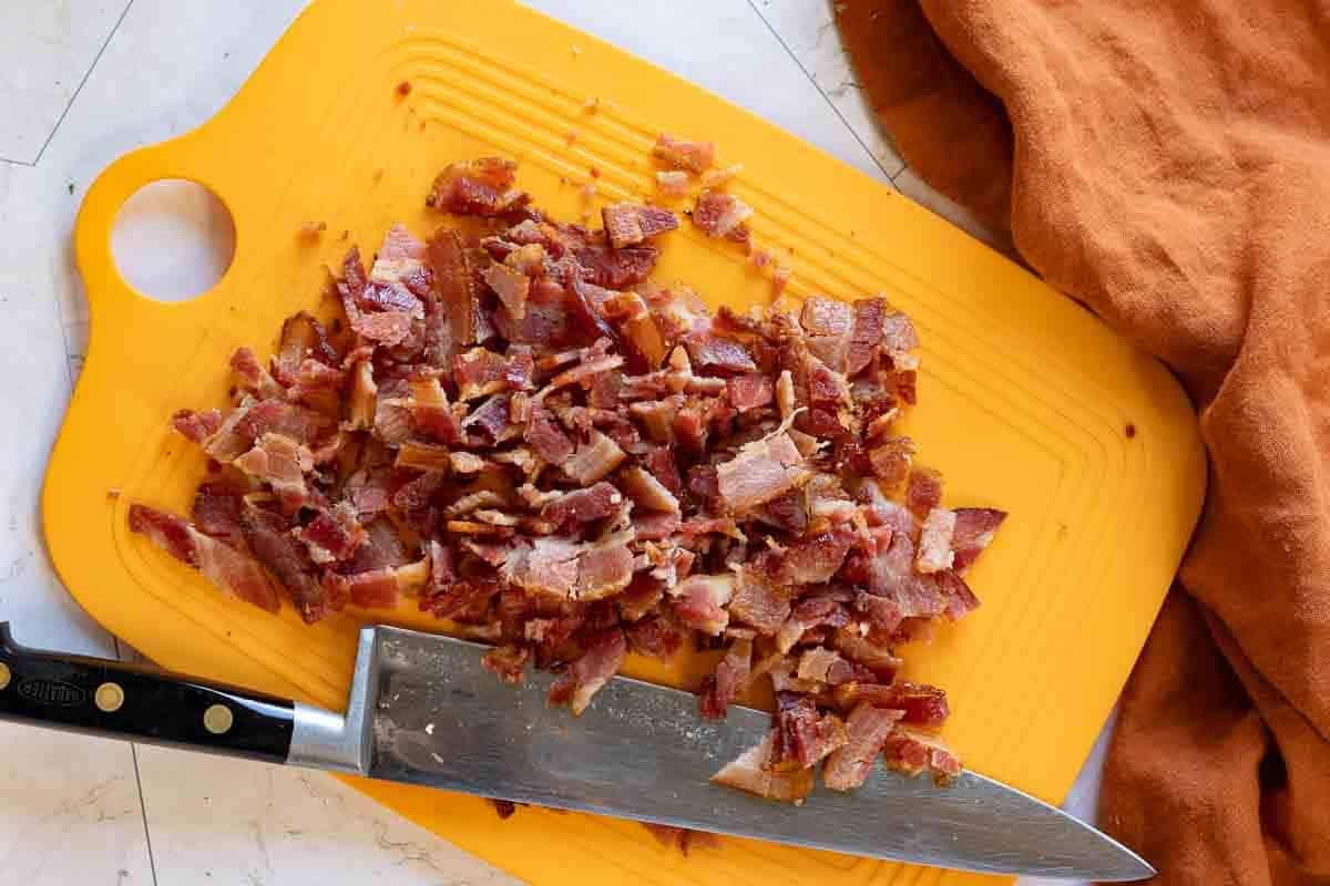 Step 5: Chopping bacon to finish Great Northern Bean Soup.
