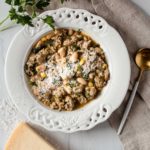 Italian White Bean Chili topped with grated parmesan and garnished with parsley