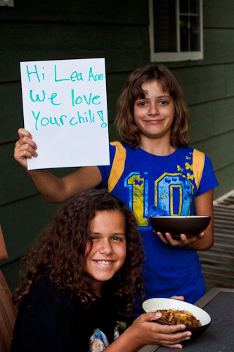 Award winning chili testimonial two children holding up a hand printed sign.