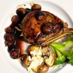 Seared and Pan roasted Veal Chops with red grapes. Perfect meal for New Year's Eve