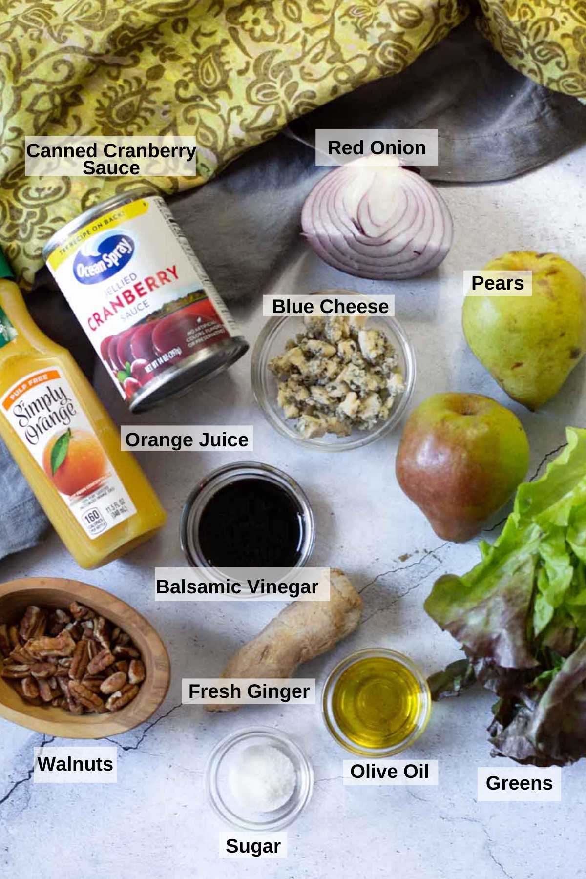 Ingredients to make cranberry vinaigrette pear walnut blue cheese salad.