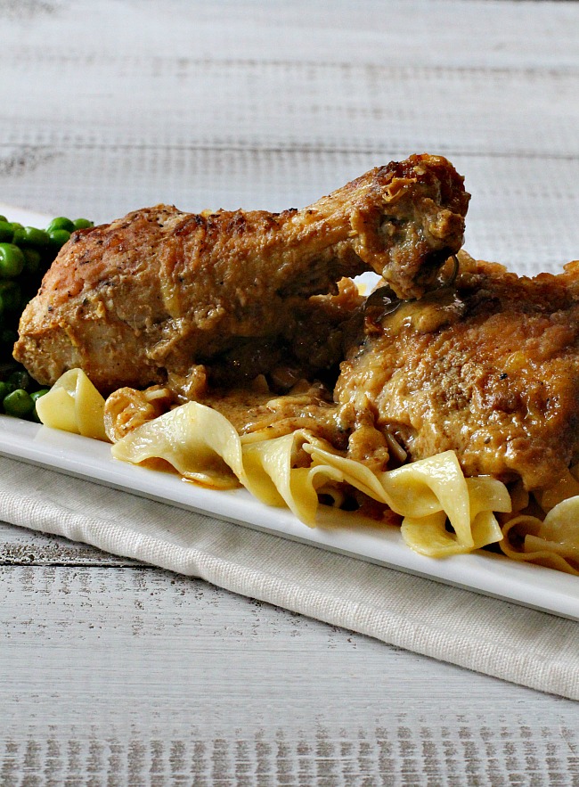 Braised chicken cooked in a veal demi-glace served over egg noodles