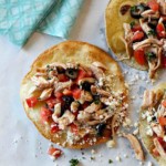 Zesty Chicken Tostadas with Feta Cheese, olives and tomatoes.