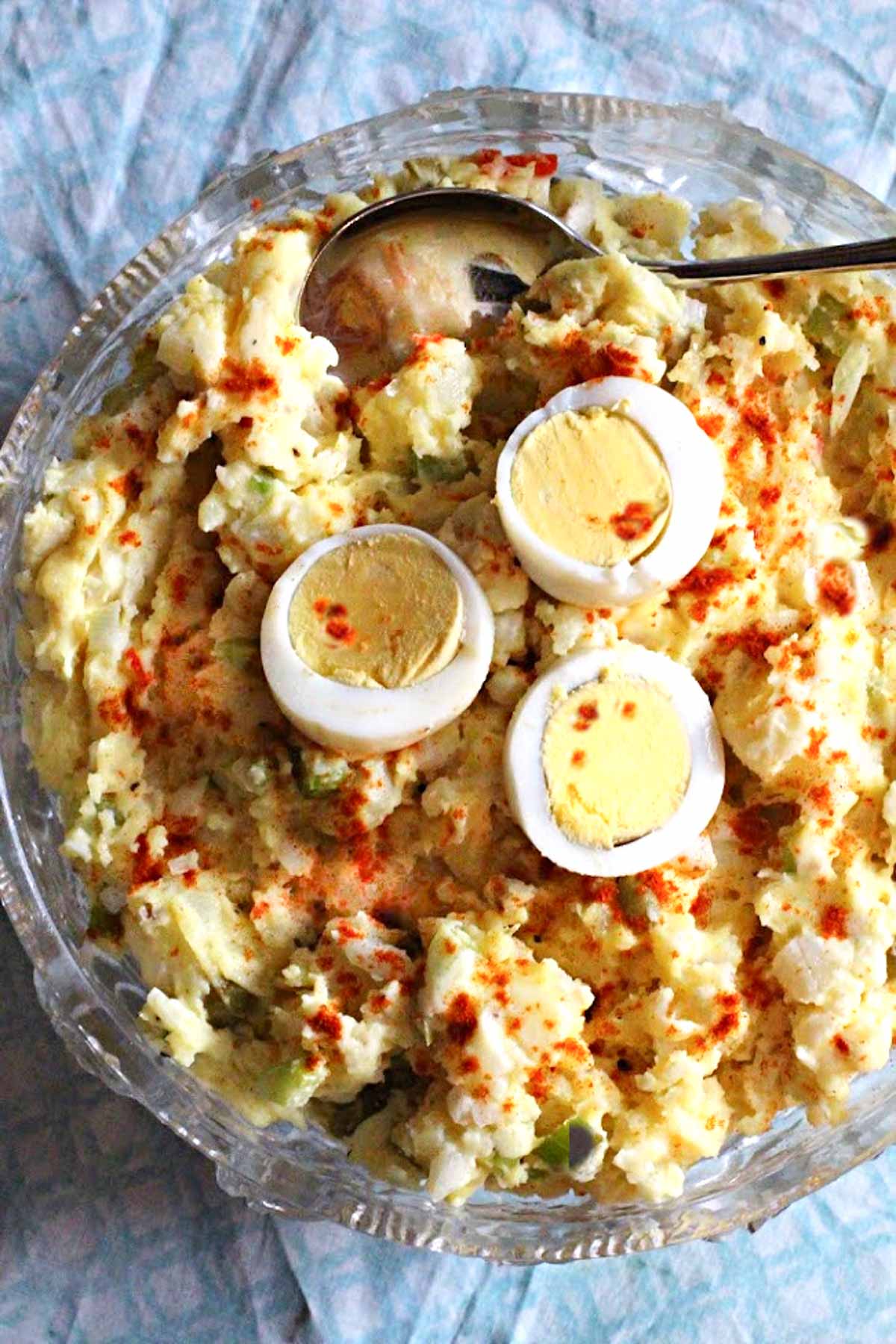 classic potato salad recipe topped with sliced hard boiled eggs