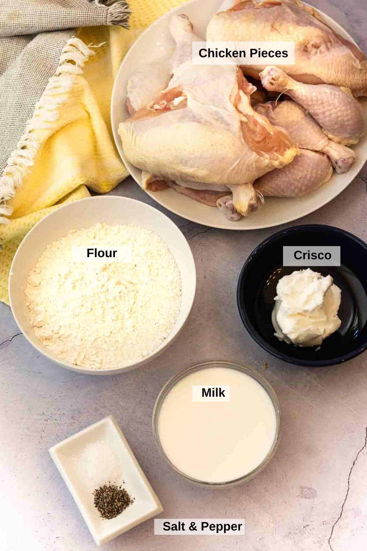 Ingredients to make fried chicken and fried chicken gravy.