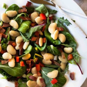 Warm Butter Bean Salad served on a white platter plate.