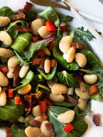 Warm Butter Bean Salad served on a white platter plate.