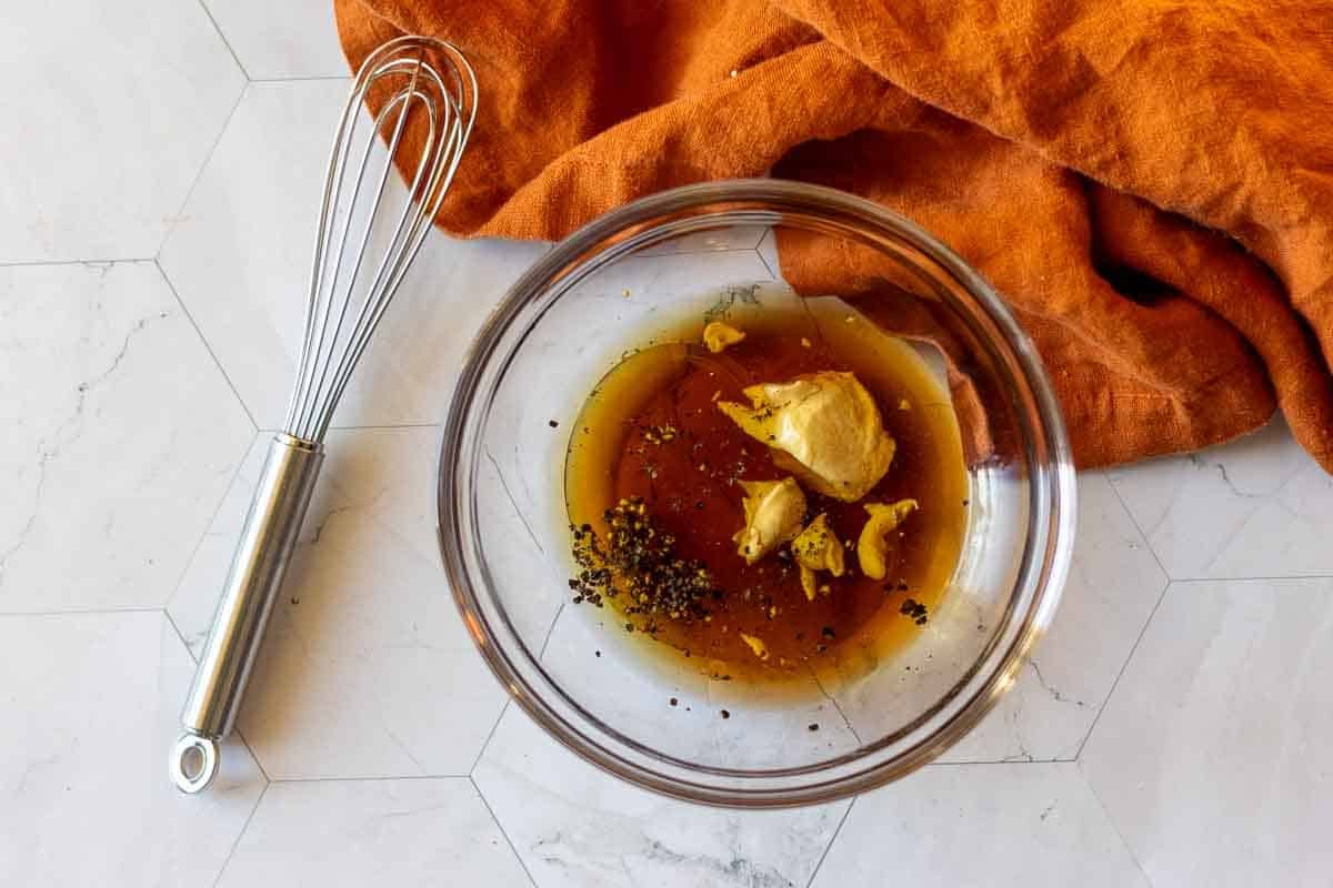 Making maple syrup vinaigrette for butter bean salad.