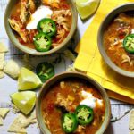 Mexican Chicken Tortilla Soup topped with sour cream and sliced jalapenos