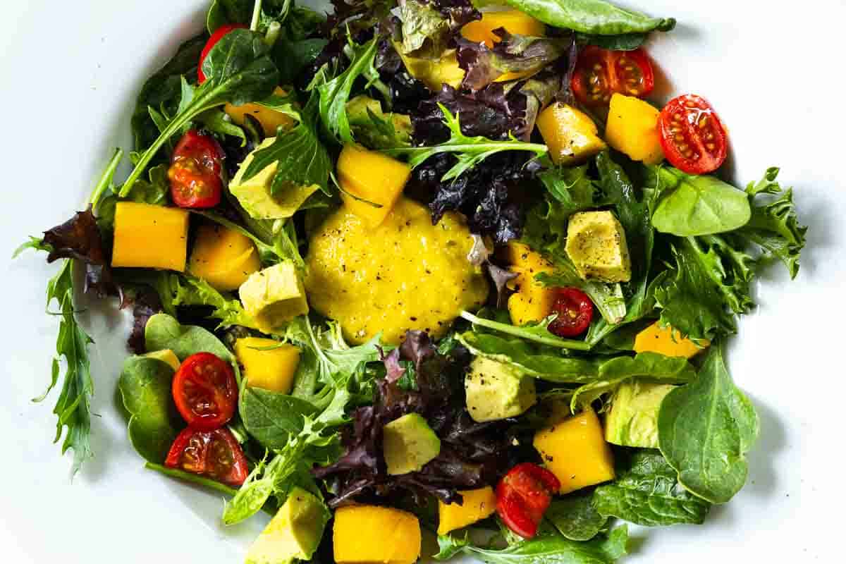 A tossed salad tomatoes, mangoes, avocado and greens. Topped with Mango Dressing.