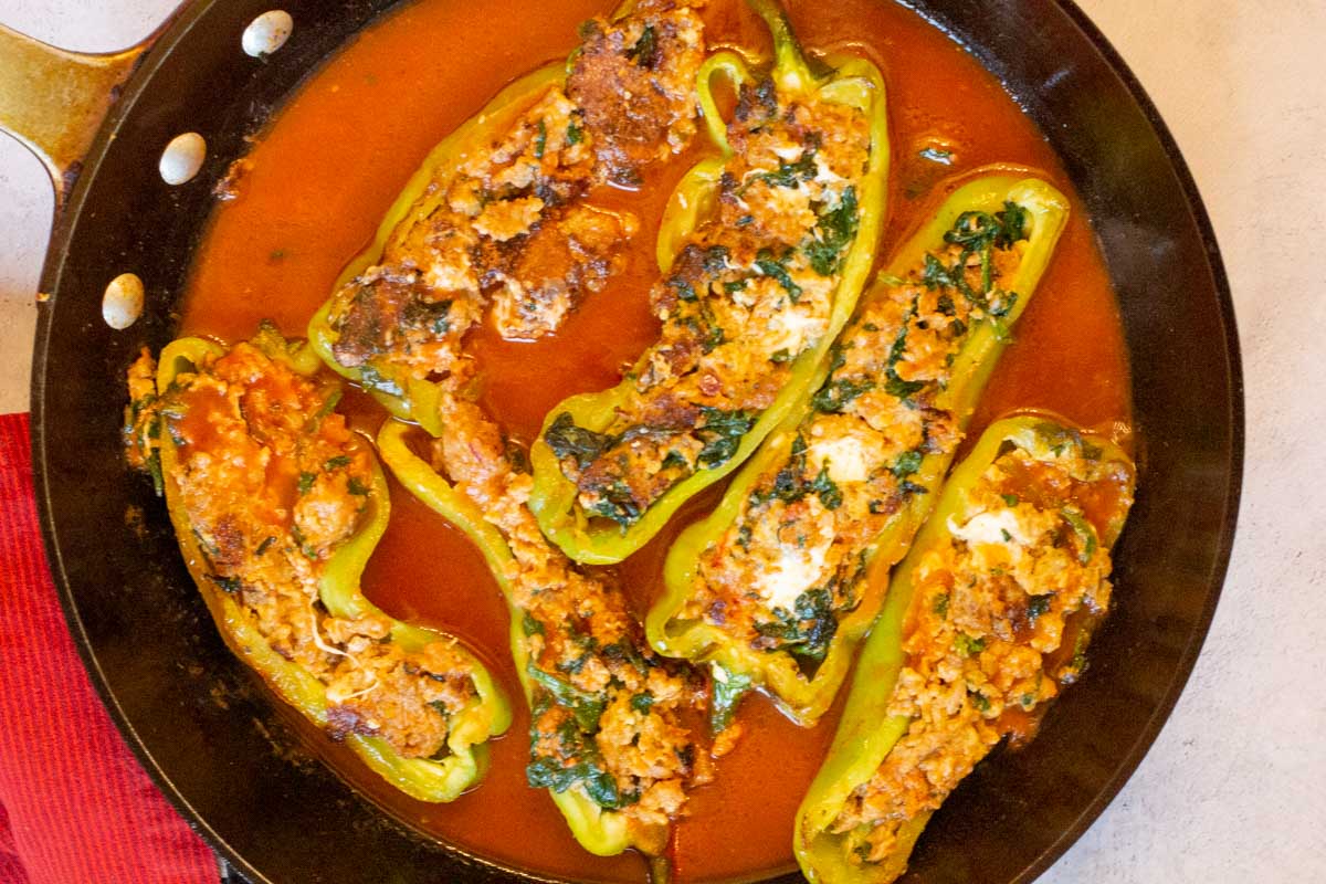 Cooking stuffed Italian Frying Peppers in Tomato Sauce.