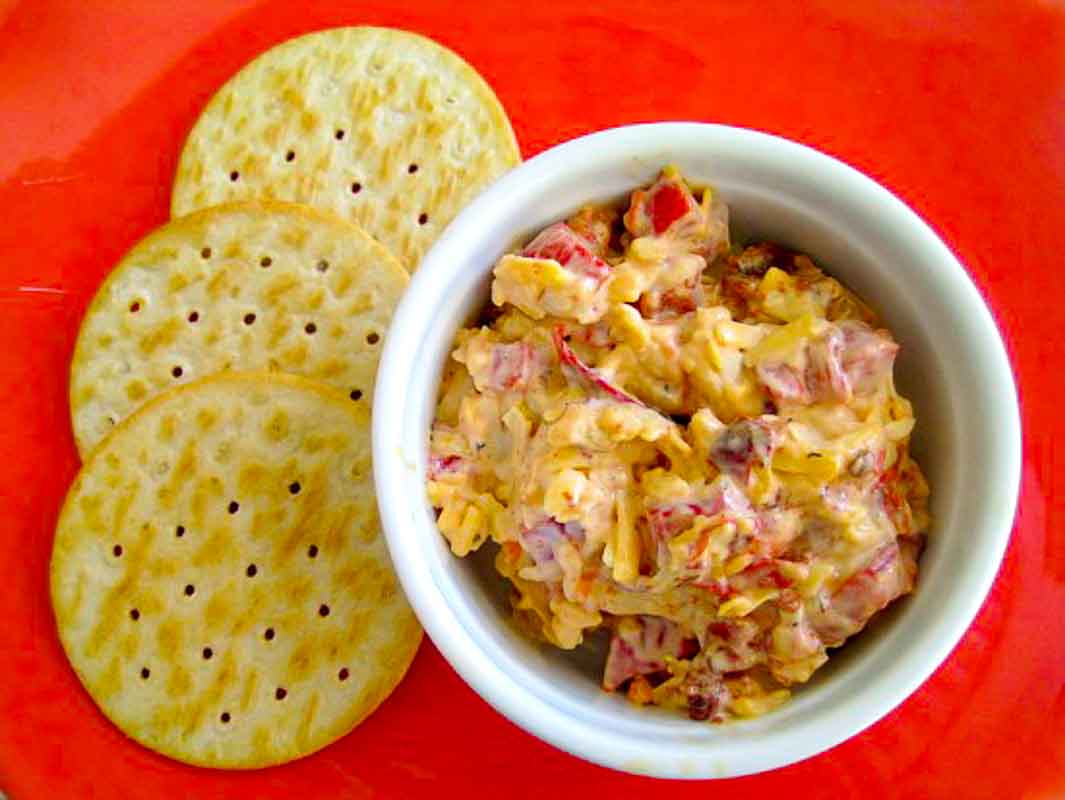 Smoky Pimento cheese spread in ramekin with Ritz crackers.