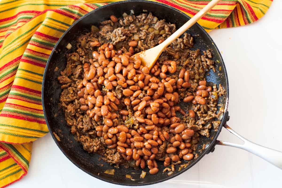 Adding beans in chile sauce to ground beef