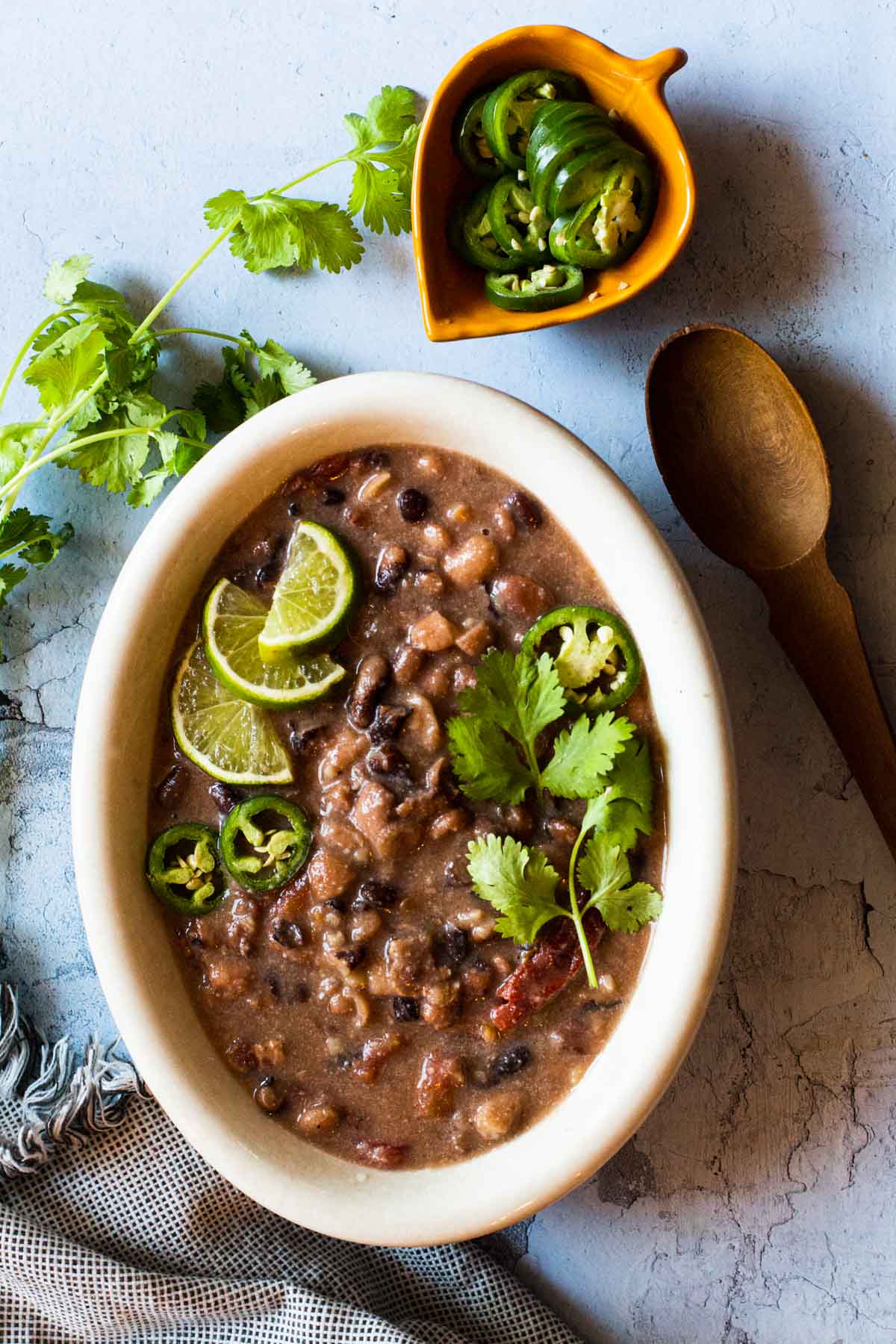 Cowboy Baked Beans recipe served in a white oval dish.