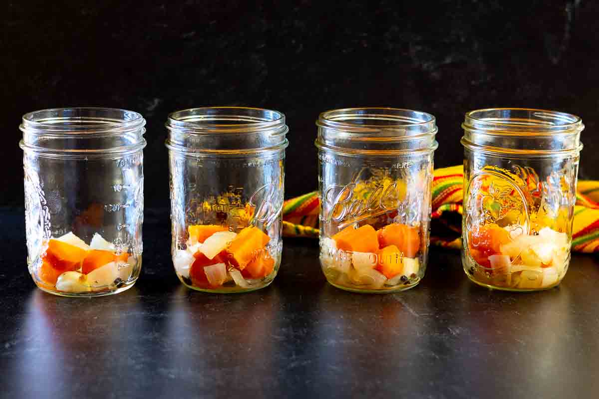 Pickles and carrots in canning jars to make pickles jalapenos.
