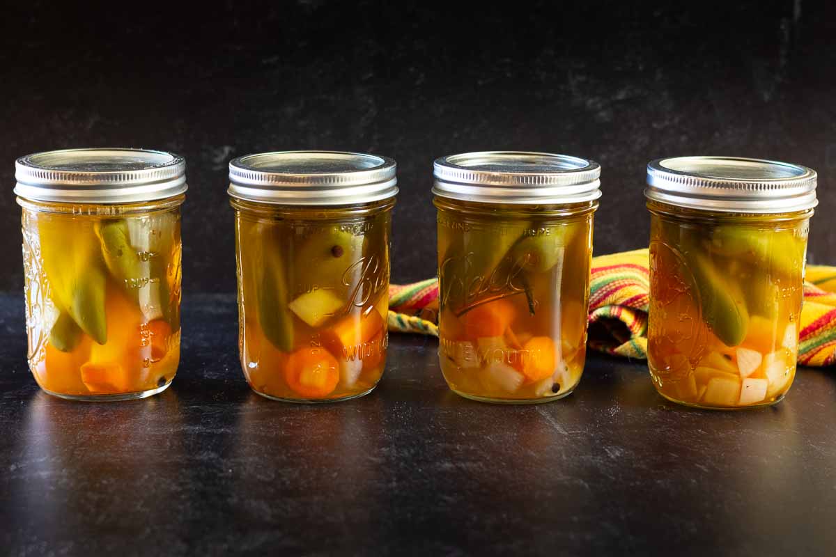 Jars of pickled jalapenos with carrots.