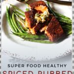 Grilled salmon rubbed with spices served over green beans