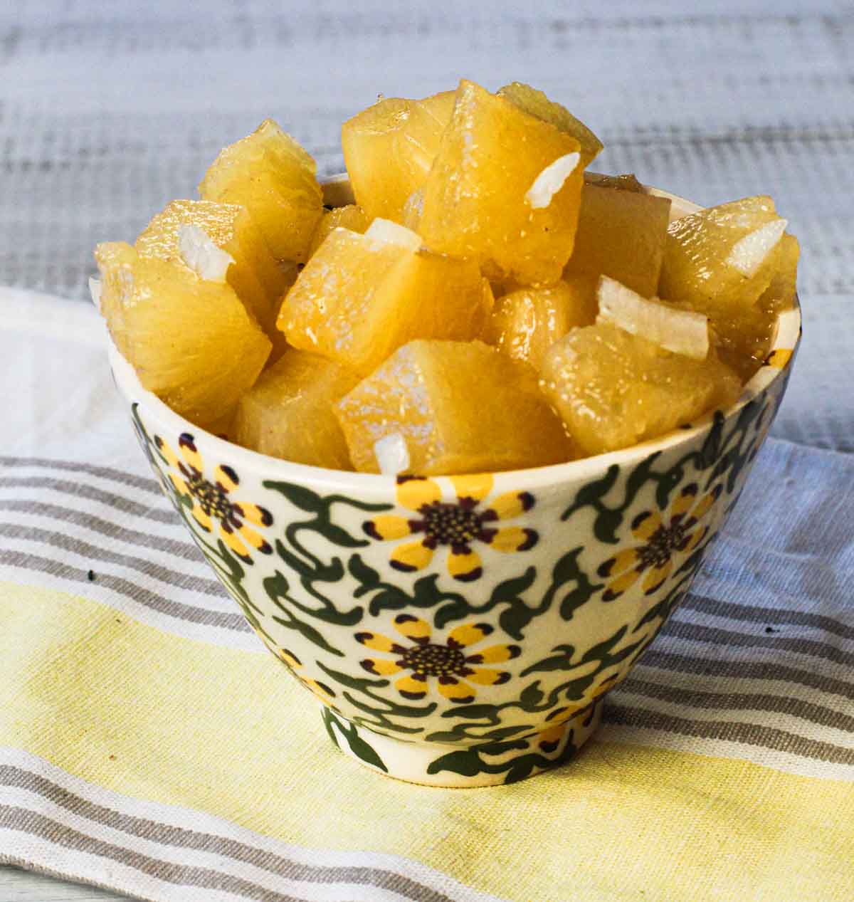 Pickled pineapple in sunflower bowl.