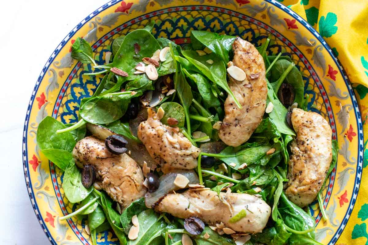 Chicken and spinach salad with citrus dressing.