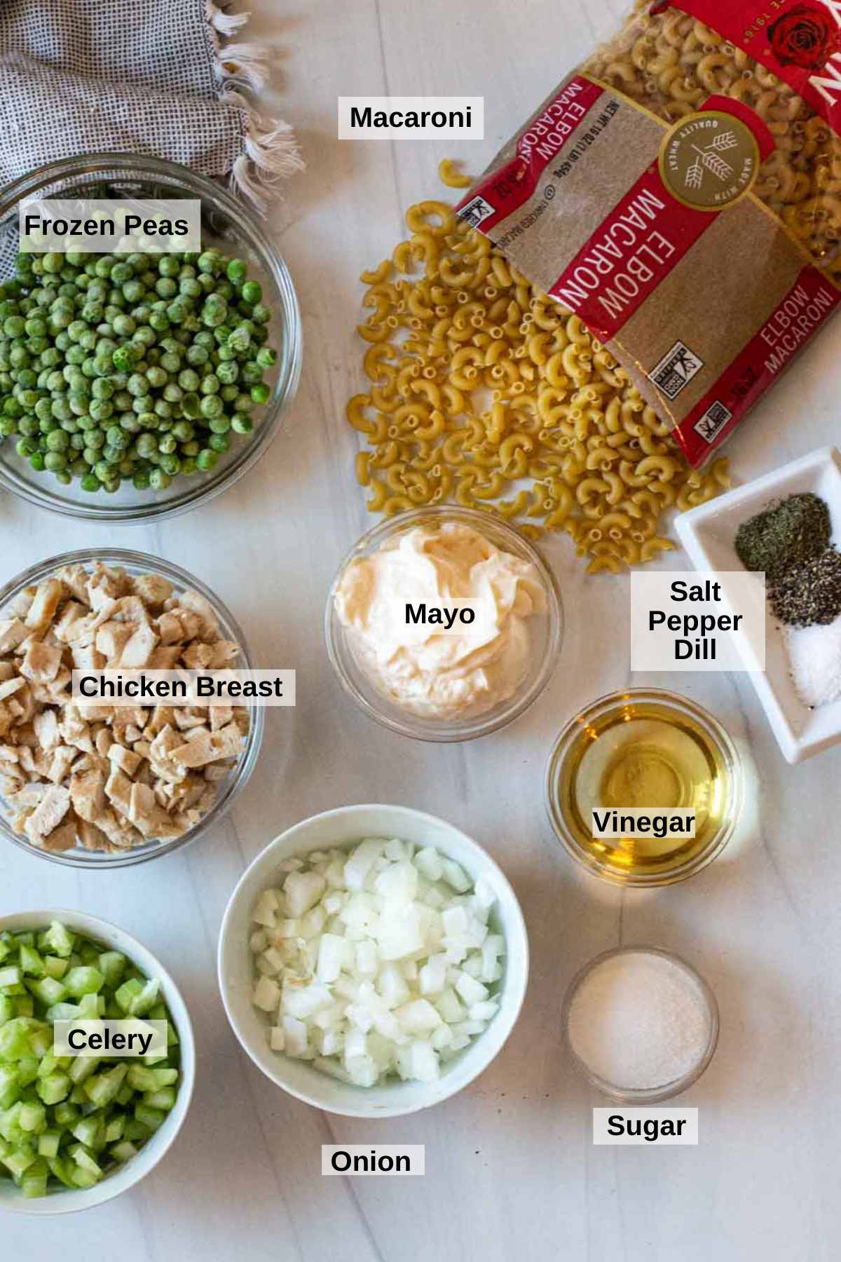 Ingredients to make macaroni chicken salad.