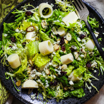 Tree House Salad. Tossed green salad with hearts of palm, craisins, blue cheese and sweet and sour dressing