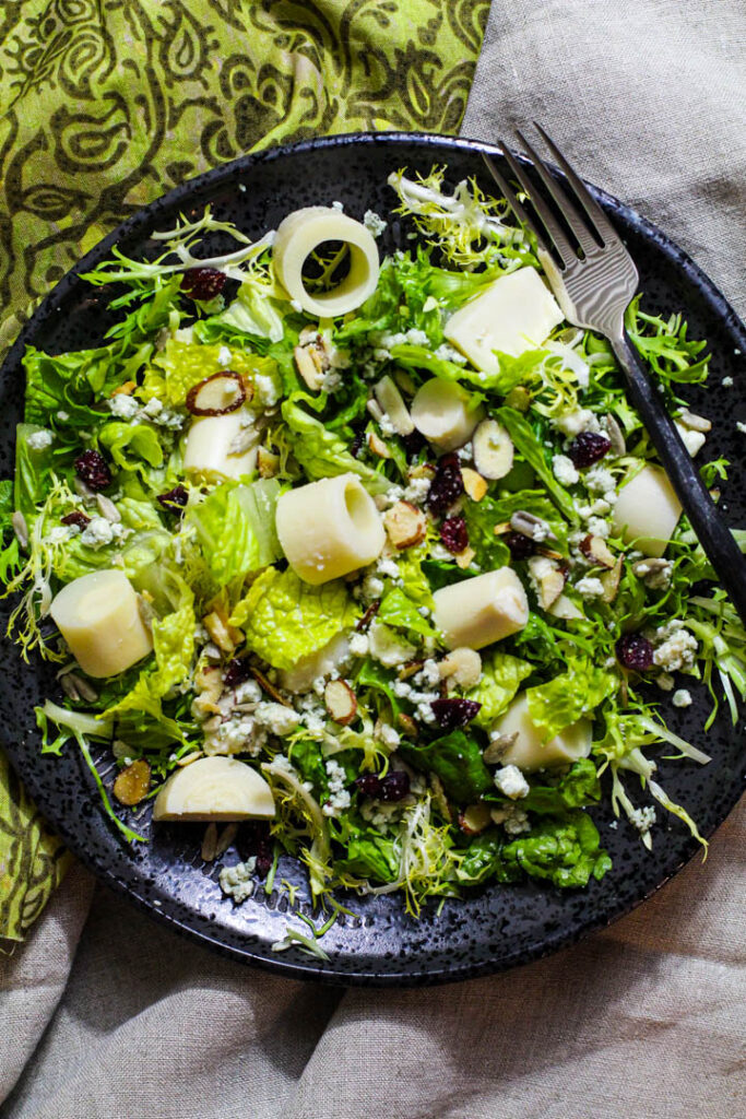 Tree House Salad. Tossed green salad with hearts of palm, craisins, blue cheese and sweet and sour dressing