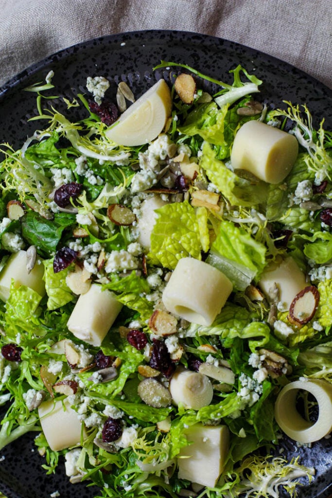 Tossed green salad with artichoke hearts, craisins, blue cheese, almonds and sweet and sour dressing.