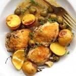 Braised chicken thighs with potatoes, lemons and olives.