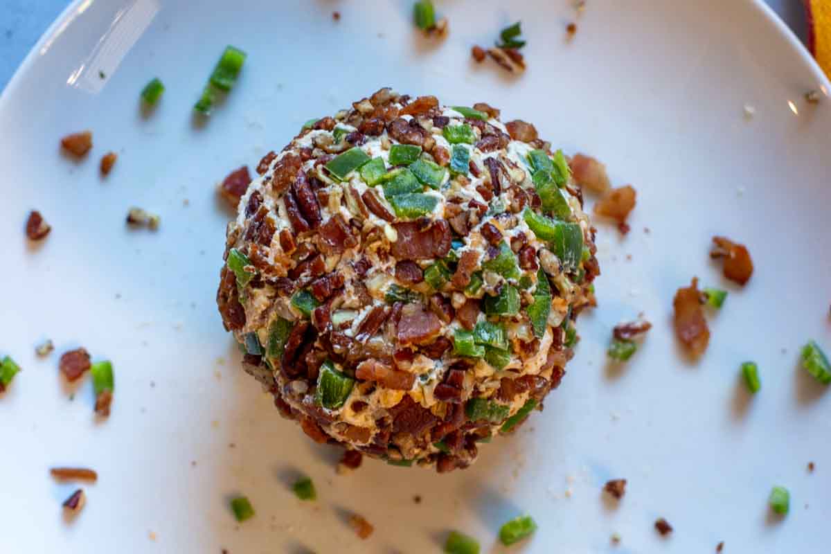 Cheeseball rolled in jalapeno peppers, pecans and bacon.