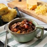 A bowl of award winning ground beef chili served with cornbread.