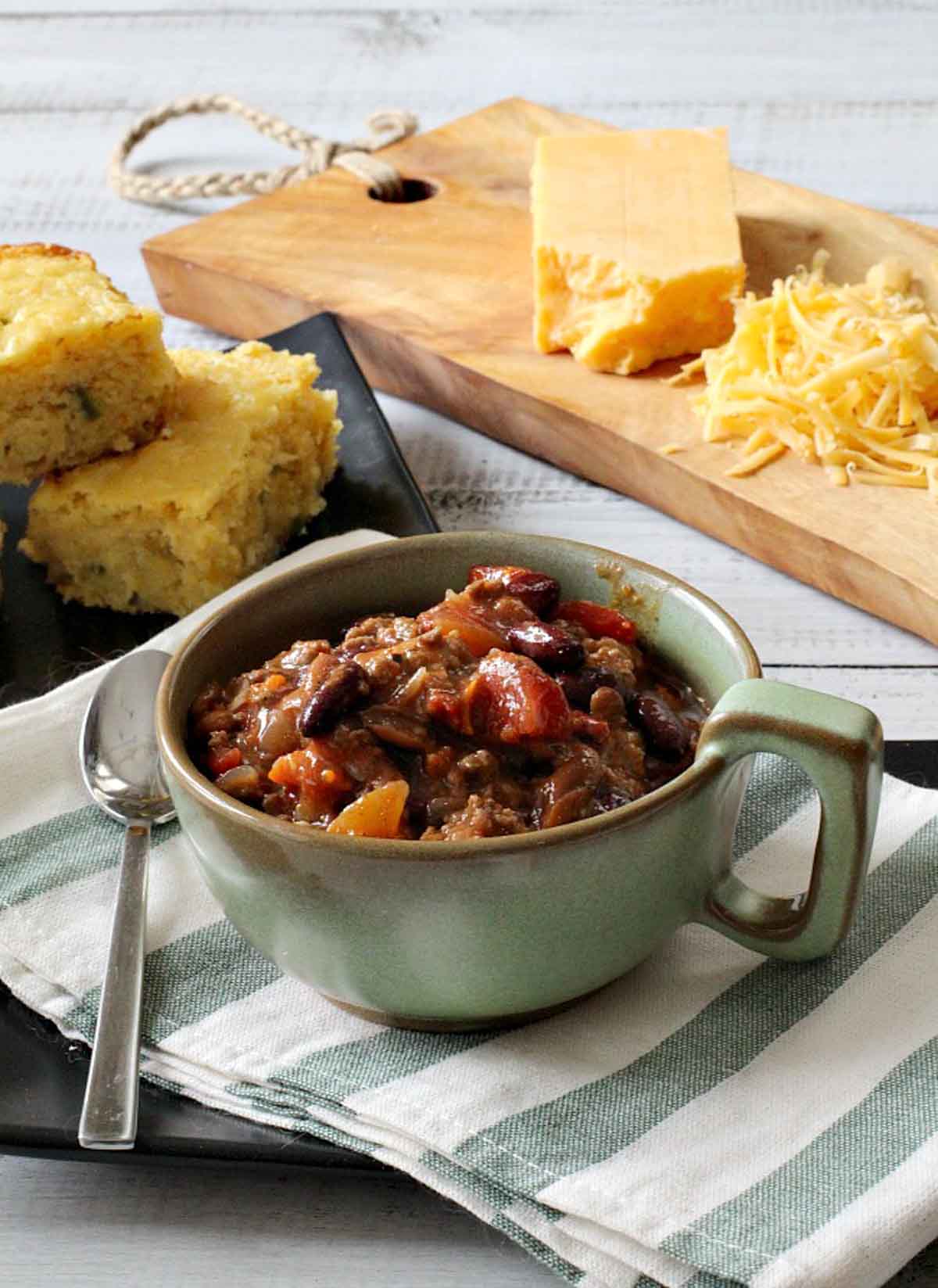 A bowl of award winning ground beef chili served with cornbread.