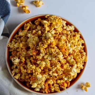 A bowl of homemade popcorn with spicy seasoning