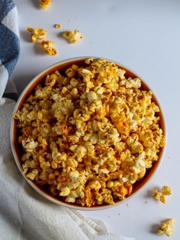 A bowl of homemade popcorn with spicy seasoning