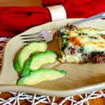 Southwestern biscuit casserole with slices of avocado.