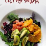 Fresh greens topped with winter fresh fruit, kiwi, grapefruit and oranges.
