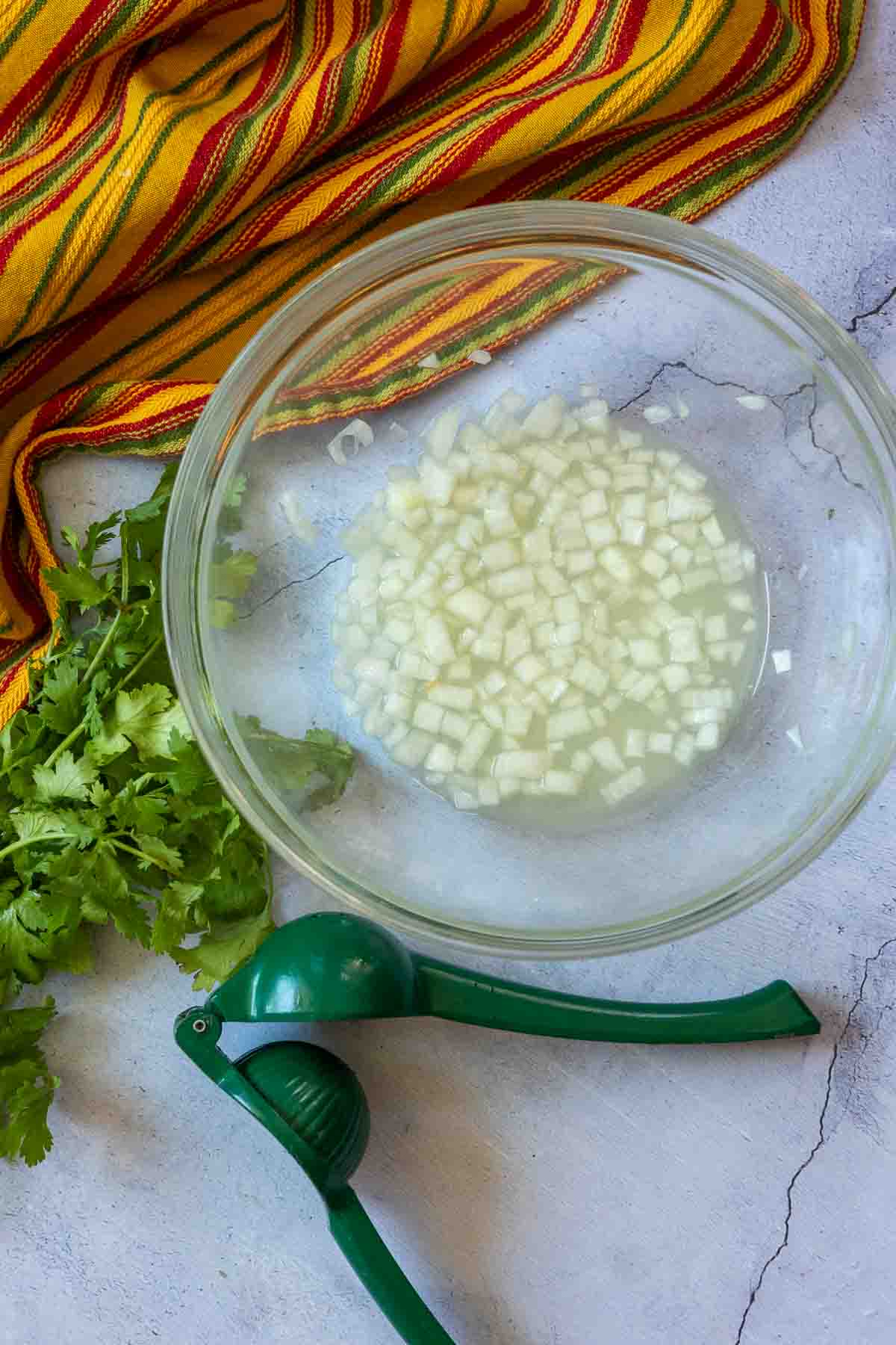 Making Campechana step 1, soaking onions in lime juice.