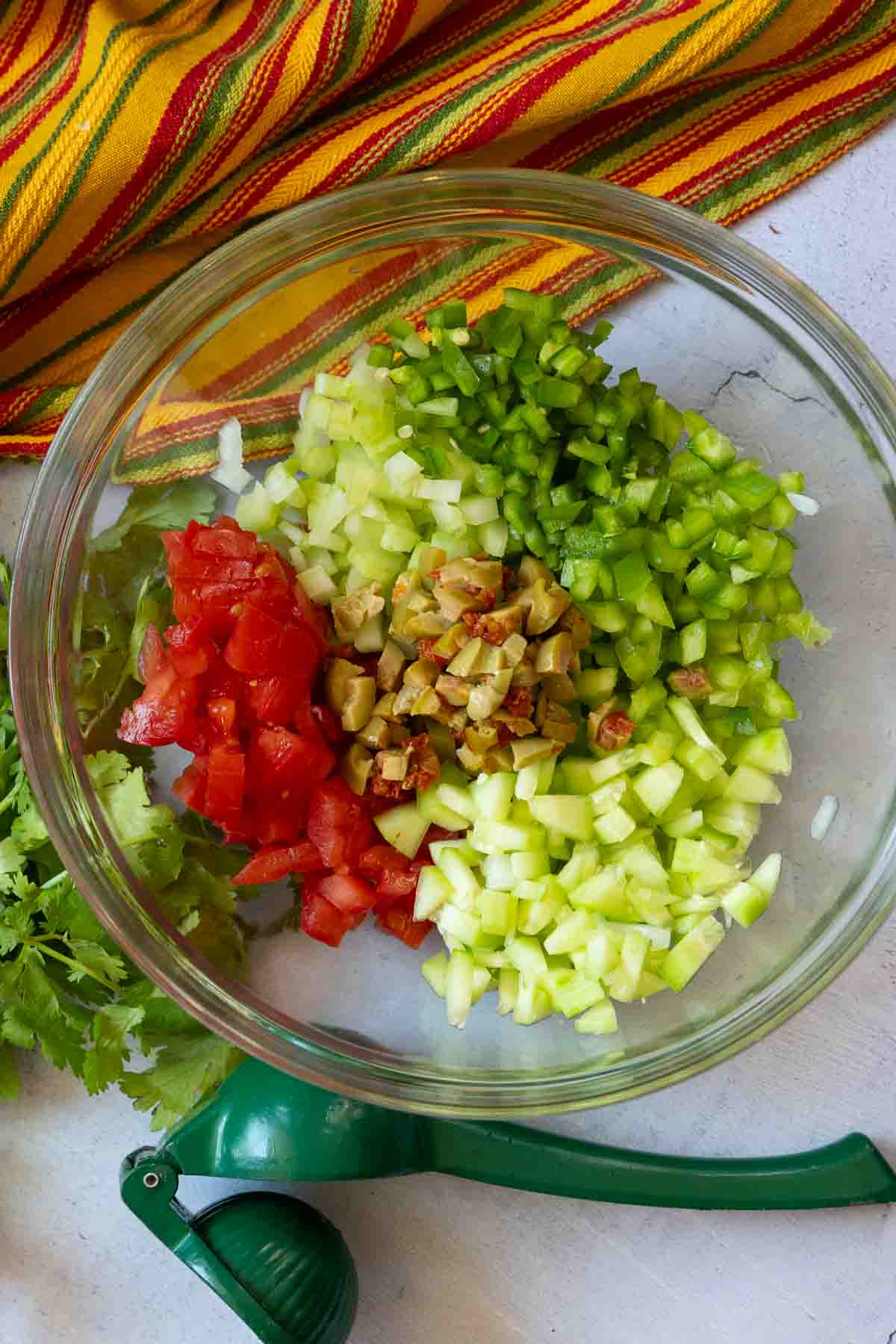 Making campechana step 2, combine chopped vegetables.