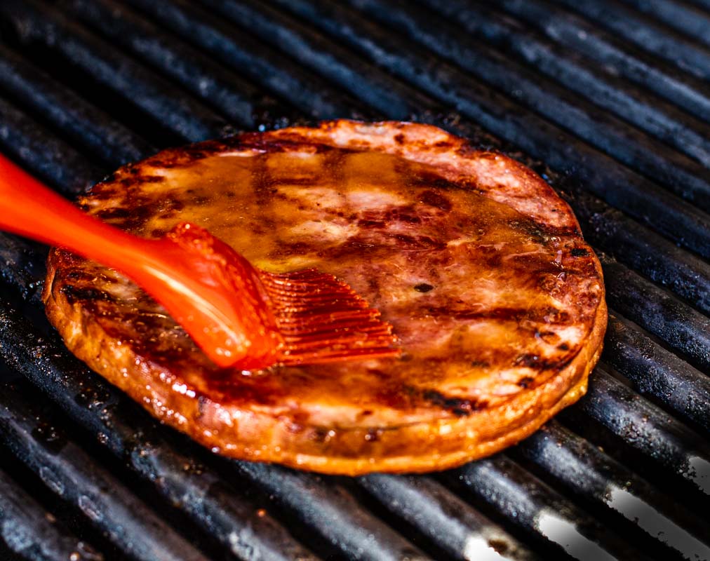 cooking ham steak on the grill