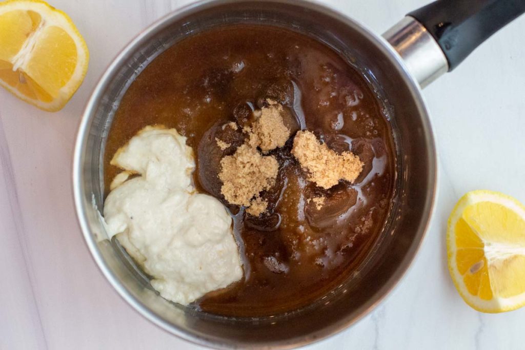 Grilled ham steak glaze in a small sauce pan