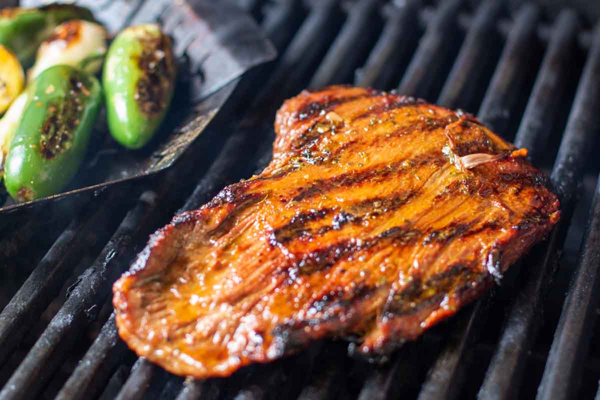 Grilling flank steak for carne asada.