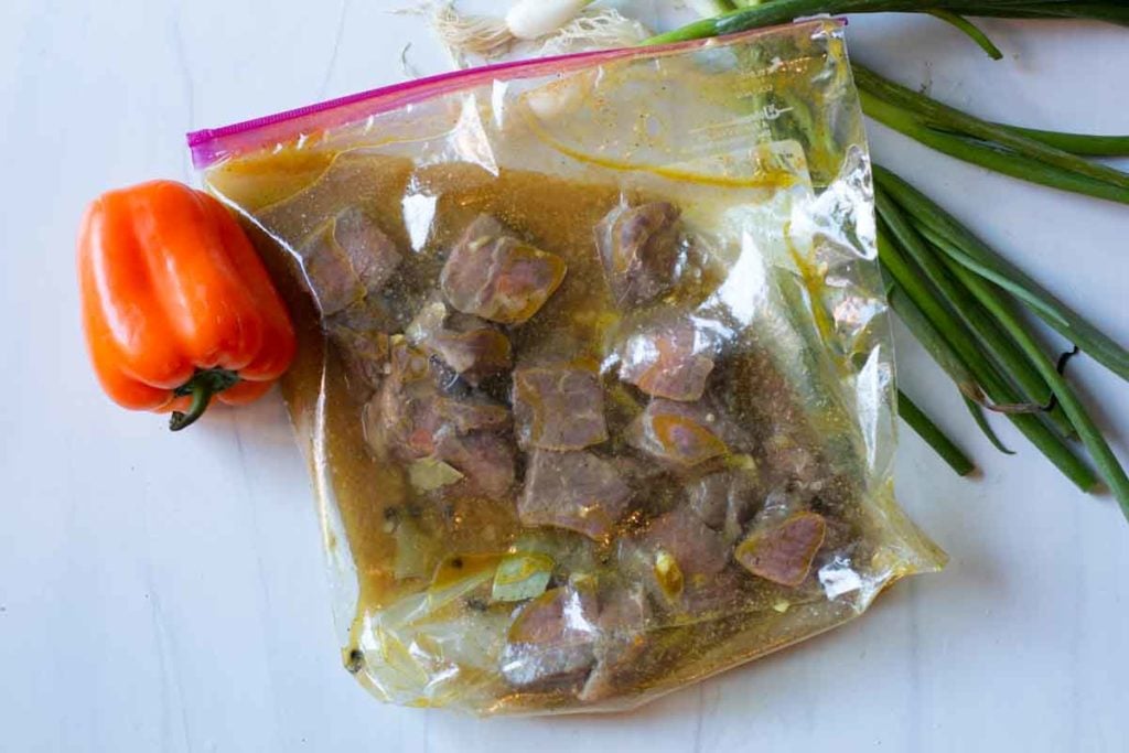 how to make steak kebabs. Placing steak and marinade ingredients in a zip lock bag