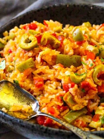 Mexican Green Rice served in a black serving bowl.