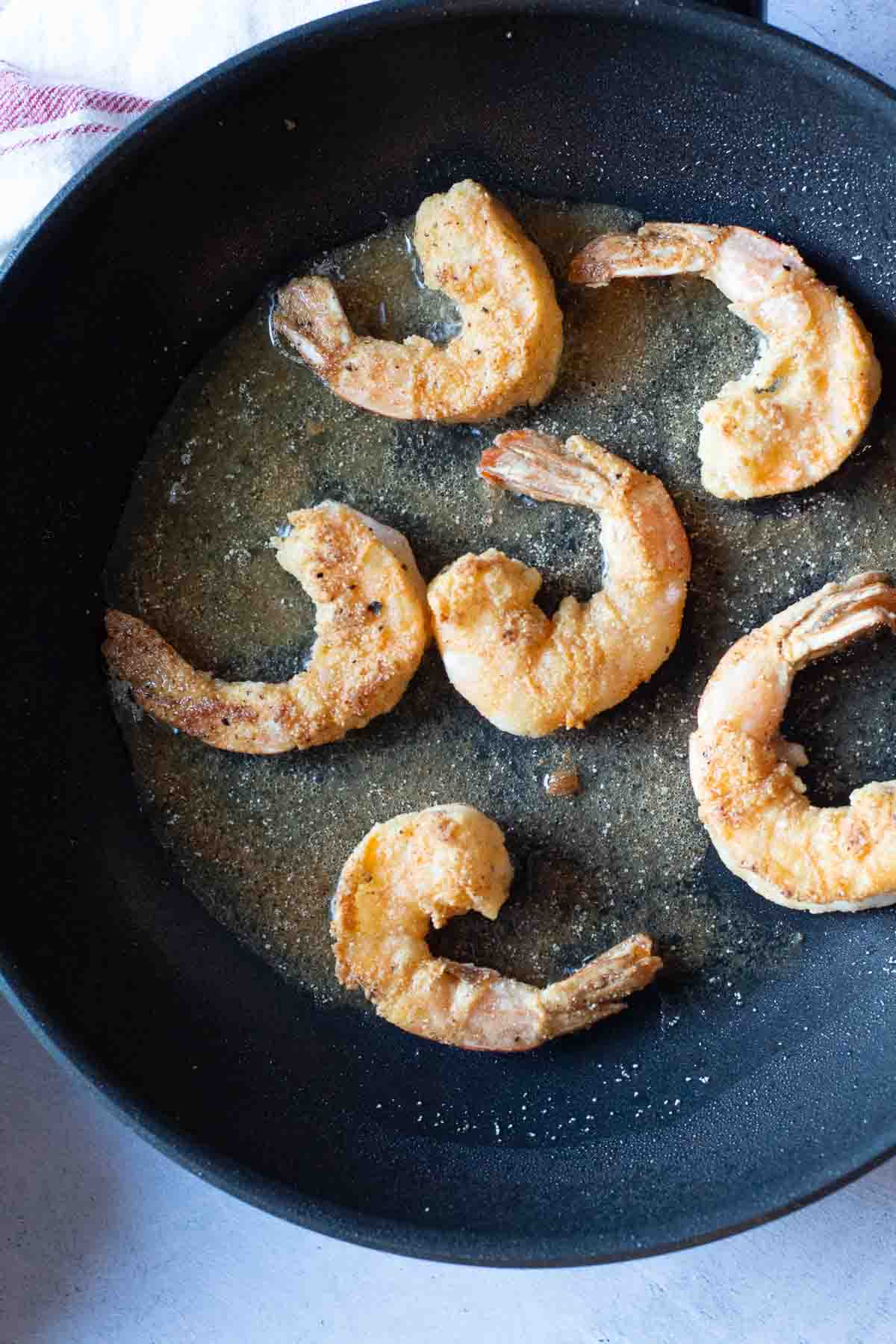 Frying shrimp to make shrimp remoulade.