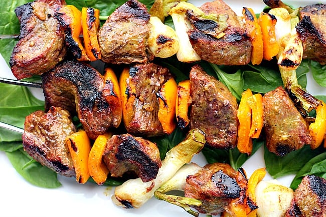 Sirloin steak beef kabobs with orange bell peppers and green onions