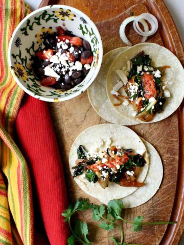 Swiss Chard tacos with caramelized onions.